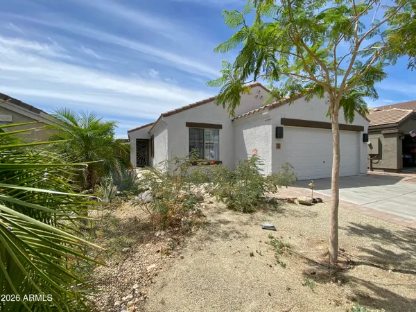 a house with a tree in front of it