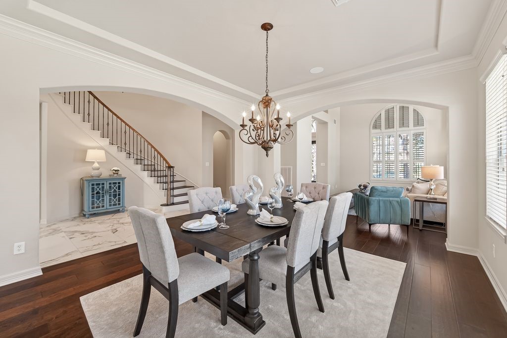 8115 Salta Verde Point Katy, TX 77494 - Photo 12 of 50 a view of a dining room with furniture window and wooden floor
