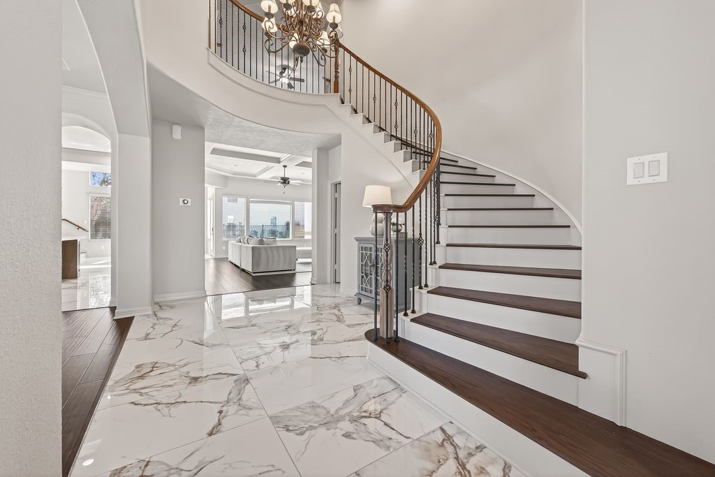 8115 Salta Verde Point Katy, TX 77494 - Photo 14 of 50 a view of a hallway with entryway wooden floor and front door