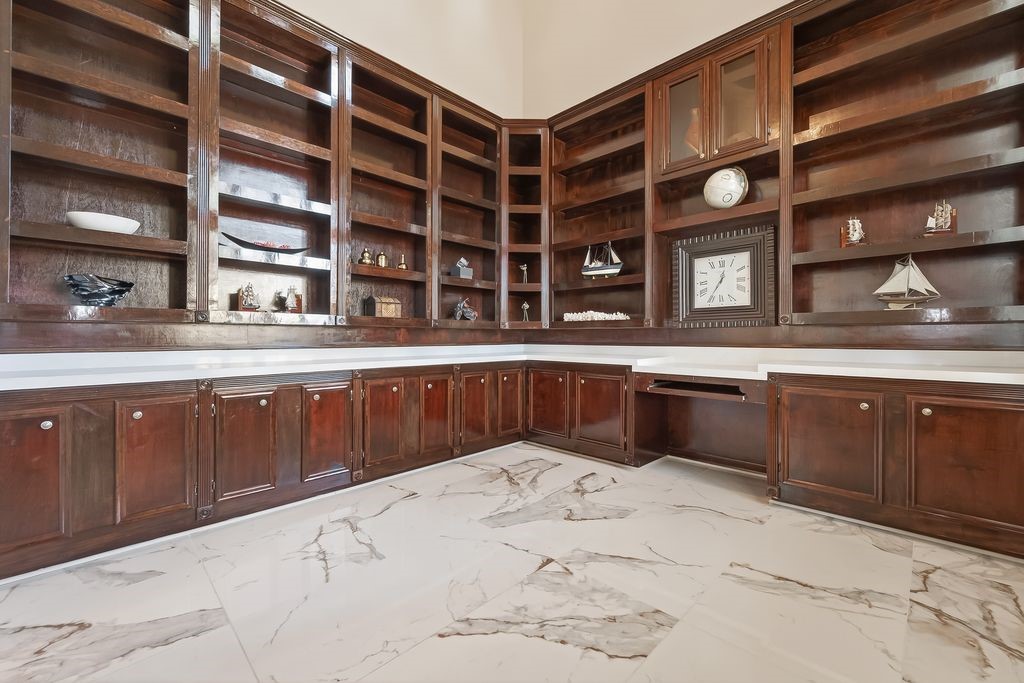 8115 Salta Verde Point Katy, TX 77494 - Photo 15 of 50 a kitchen with a sink and cabinets
