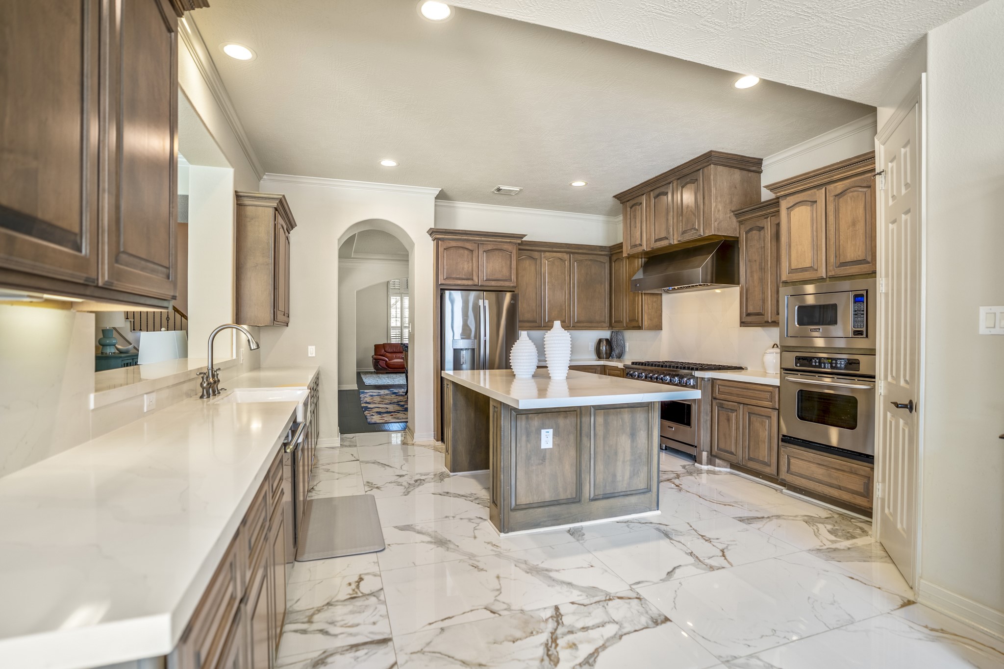 8115 Salta Verde Point Katy, TX 77494 - Photo 16 of 50 a large kitchen with stainless steel appliances lots of counter top space