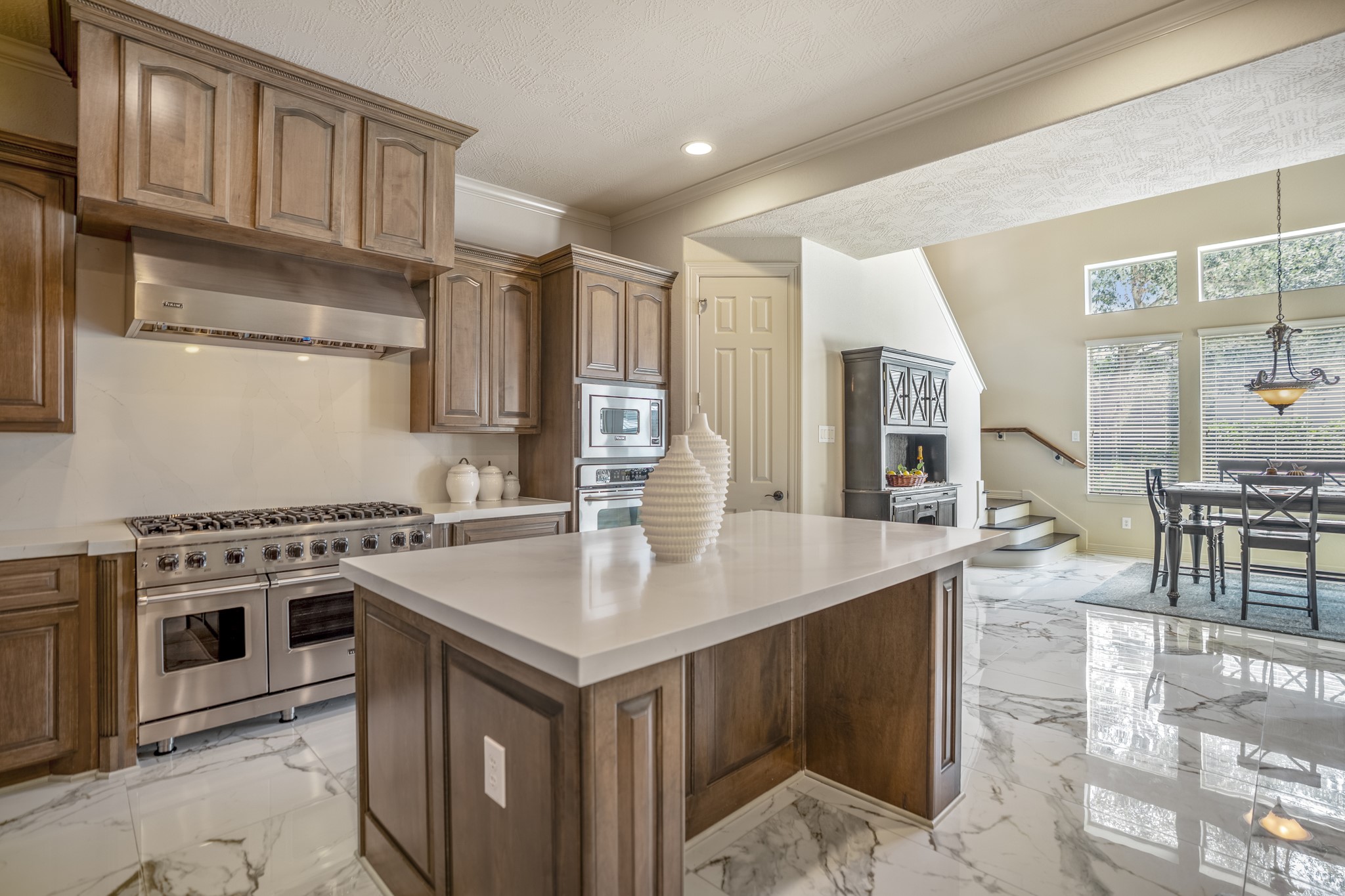 8115 Salta Verde Point Katy, TX 77494 - Photo 19 of 50 a kitchen with a stove a sink and a refrigerator