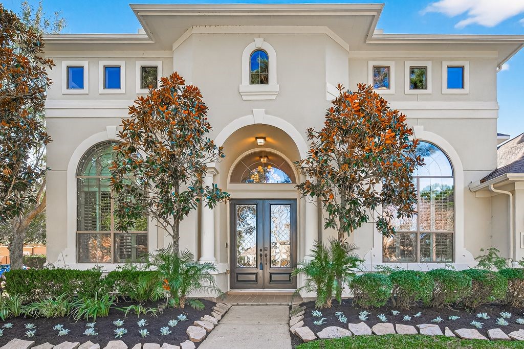 8115 Salta Verde Point Katy, TX 77494 - Photo 2 of 50 a front view of a house with garden