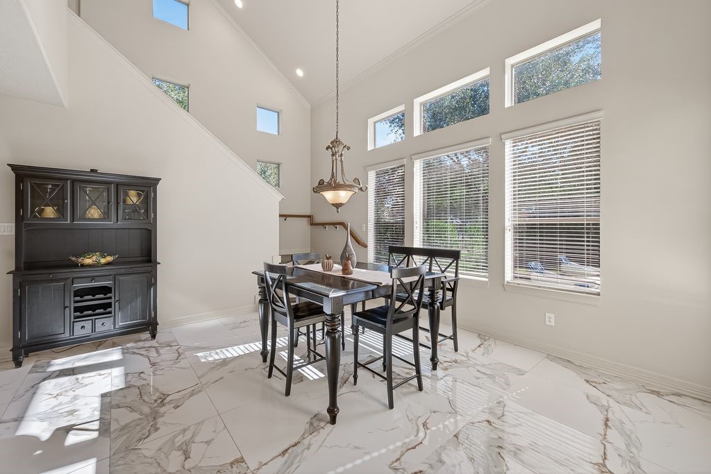 8115 Salta Verde Point Katy, TX 77494 - Photo 24 of 50 a view of a dining room with furniture and chandelier