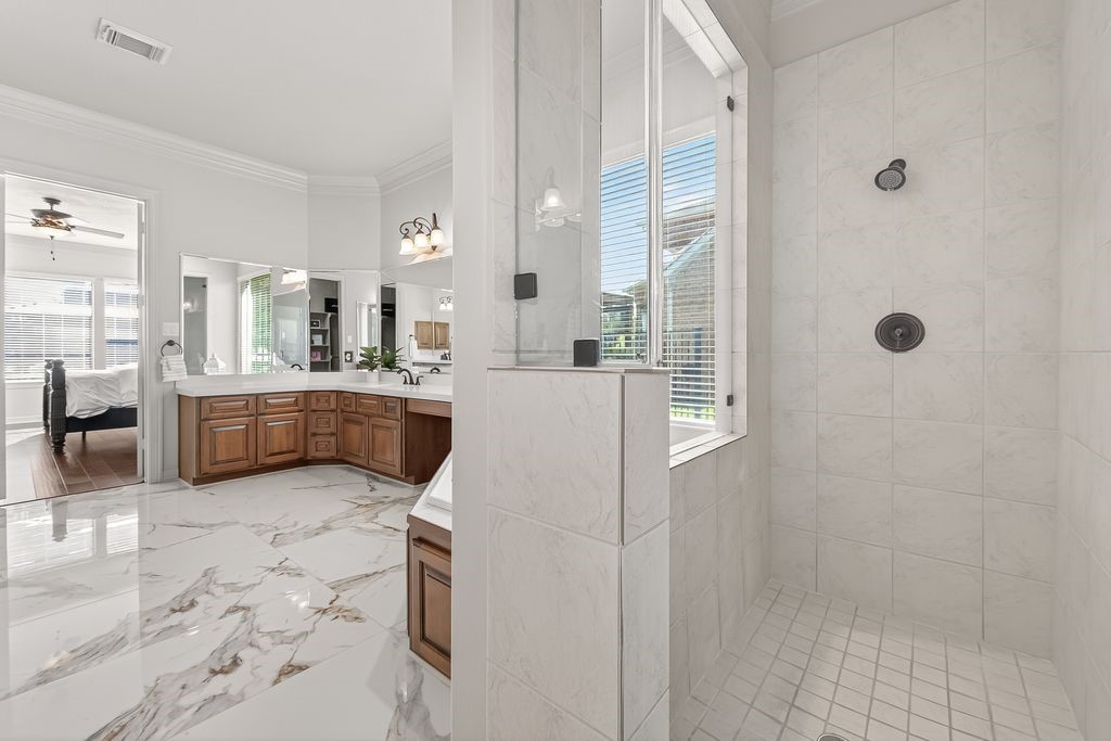 8115 Salta Verde Point Katy, TX 77494 - Photo 33 of 50 a large white kitchen with a sink a refrigerator and window