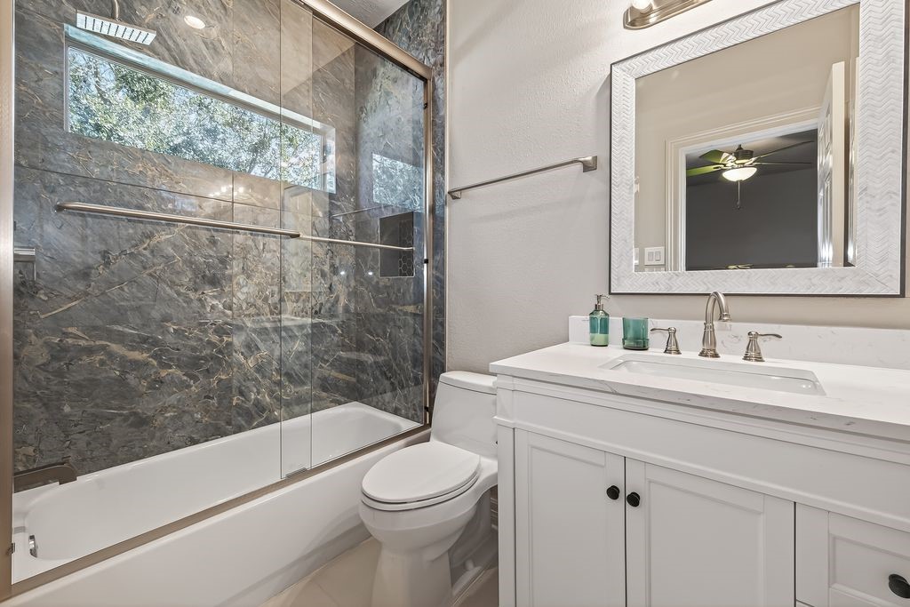 8115 Salta Verde Point Katy, TX 77494 - Photo 41 of 50 a bathroom with a sink a toilet and shower