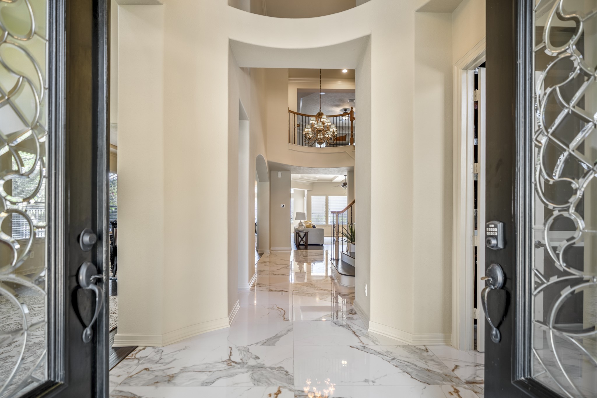 8115 Salta Verde Point Katy, TX 77494 - Photo 7 of 50 a view of a hallway with bathroom and wooden floor