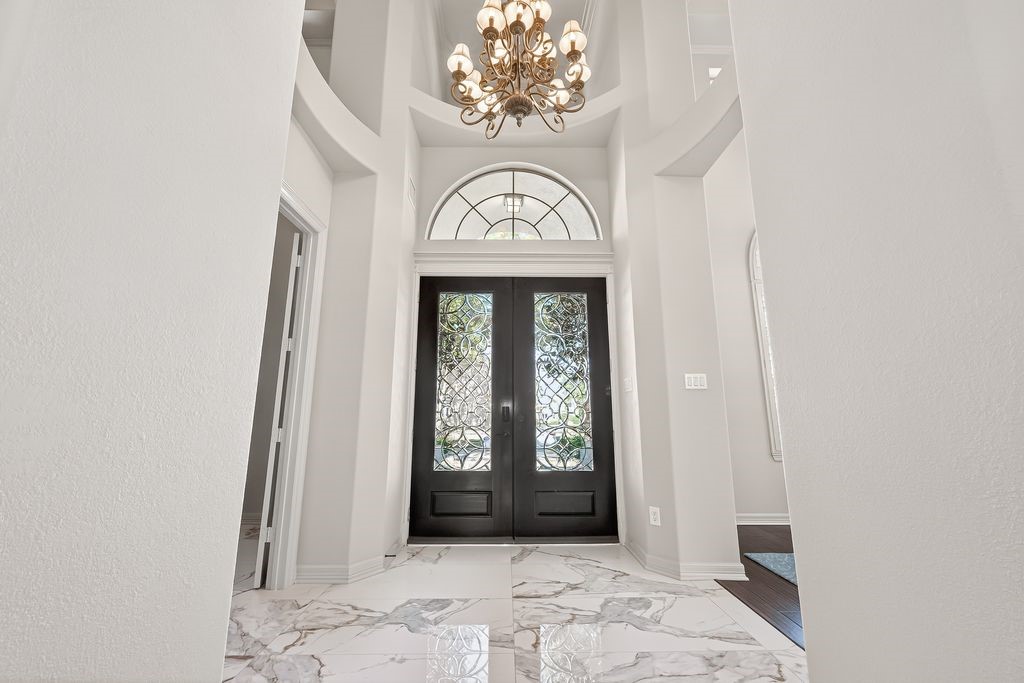 8115 Salta Verde Point Katy, TX 77494 - Photo 8 of 50 a view of an entryway with a chandelier
