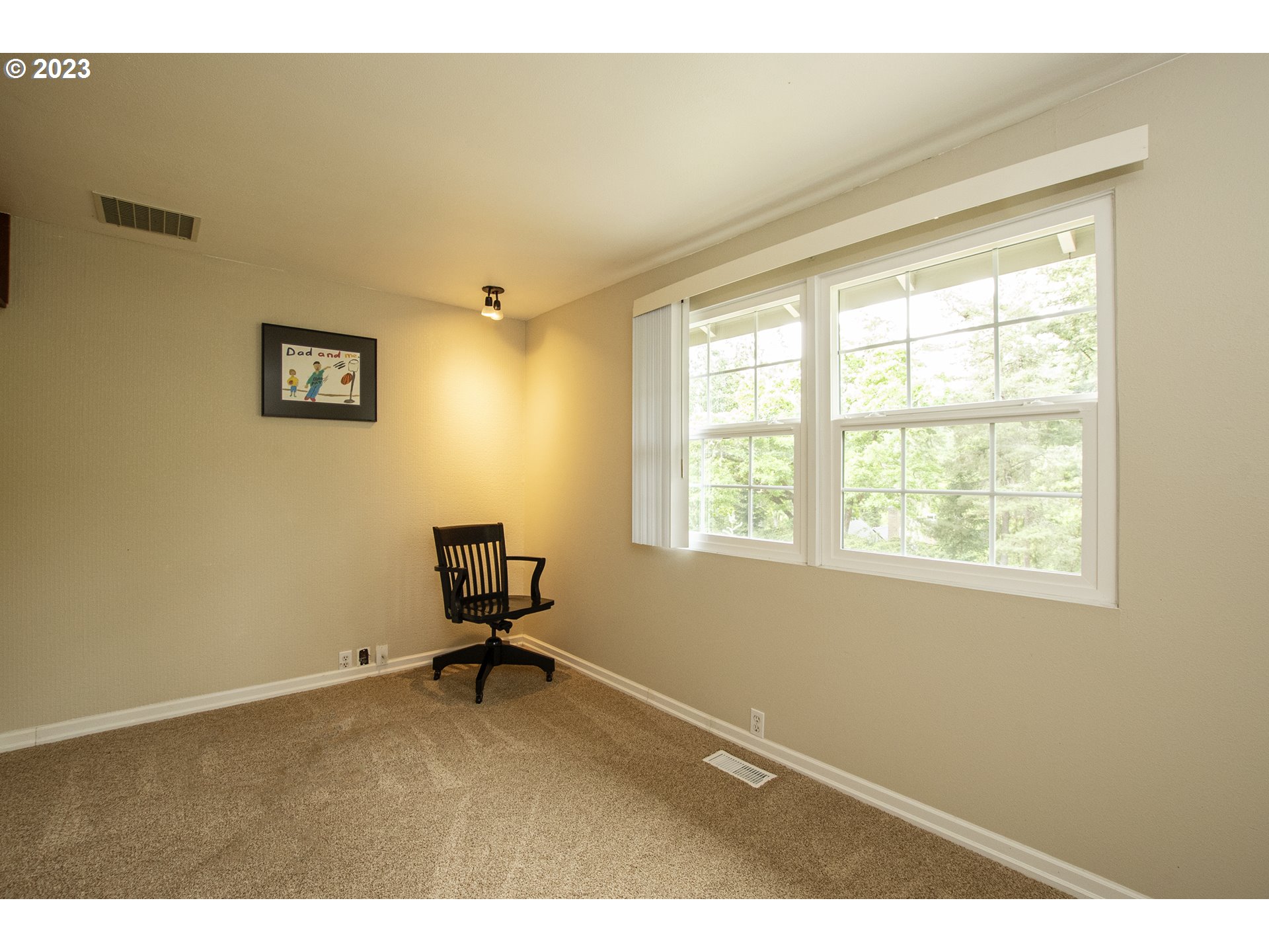 197 Brae Burn Drive Eugene, OR 97405 - Photo 21 of 42 a room with a window and a chair