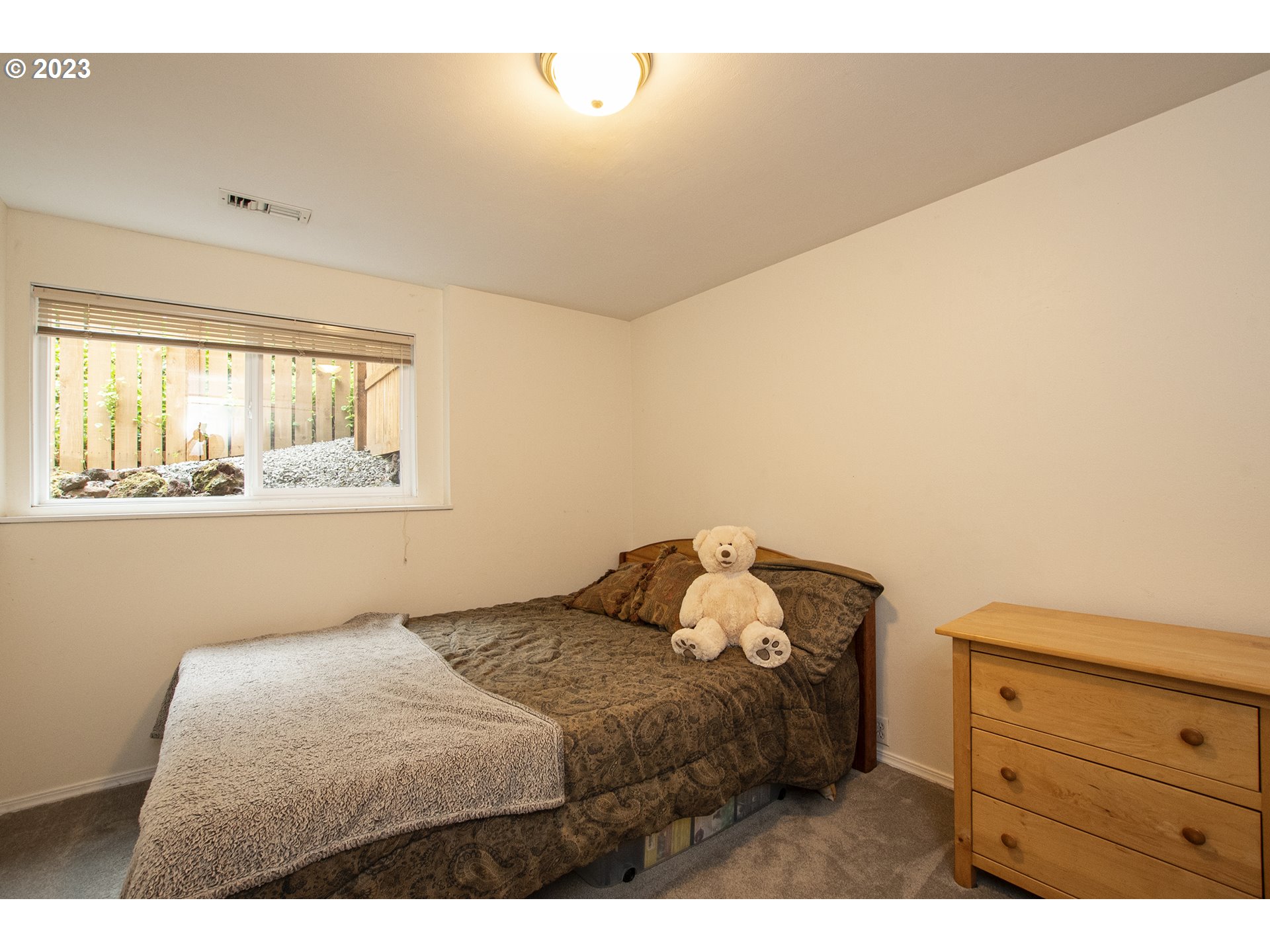 197 Brae Burn Drive Eugene, OR 97405 - Photo 28 of 42 a bedroom with a bed and a window