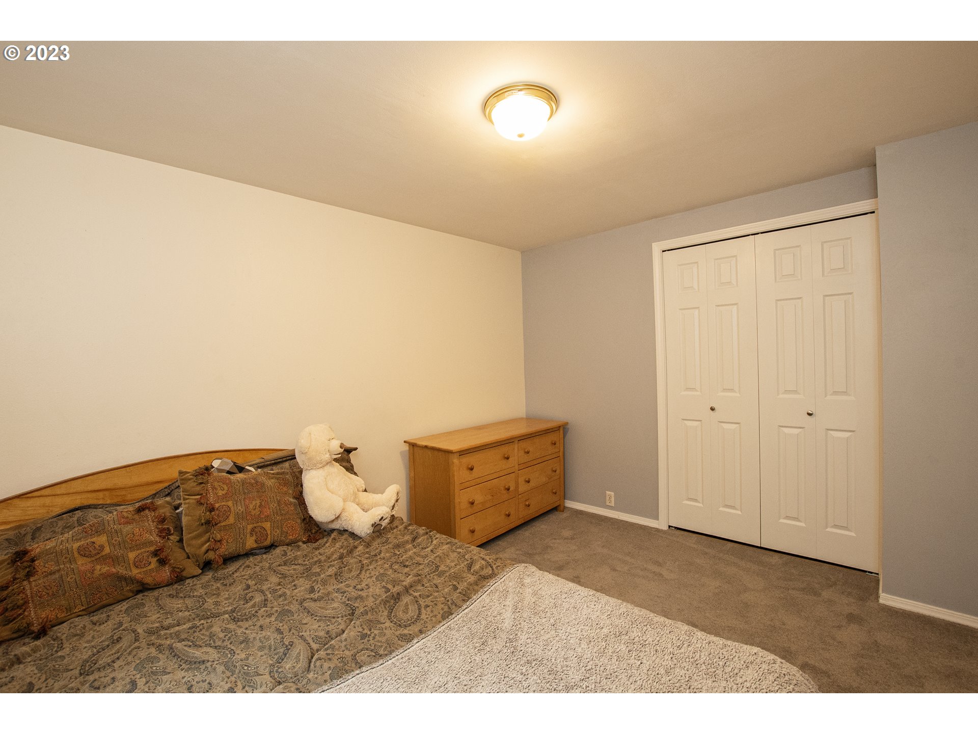 197 Brae Burn Drive Eugene, OR 97405 - Photo 29 of 42 a bedroom with a bed and cabinet