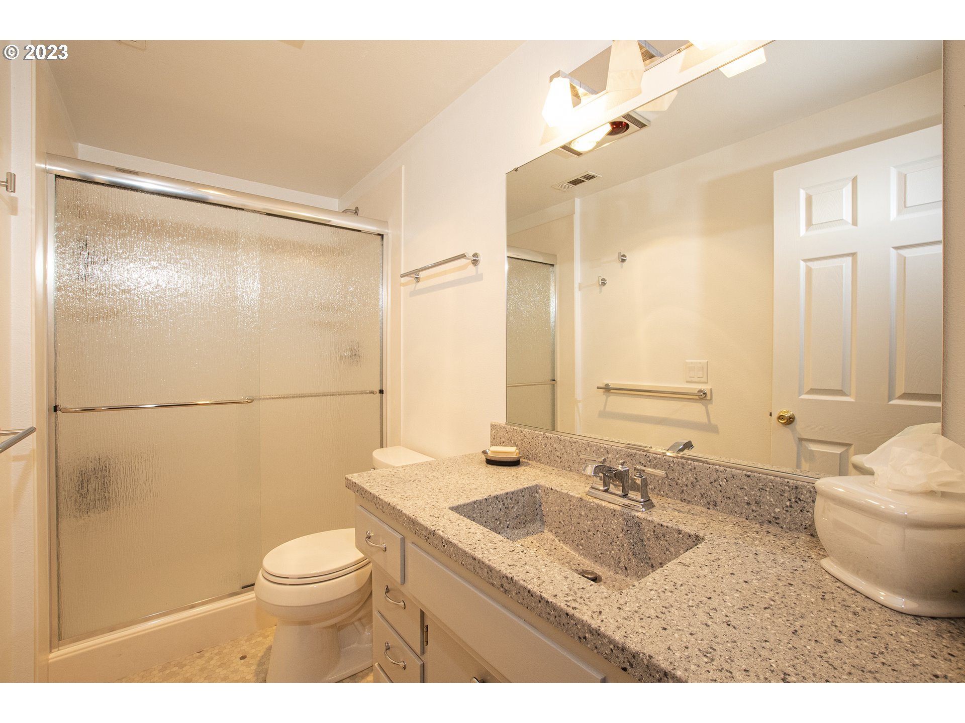 197 Brae Burn Drive Eugene, OR 97405 - Photo 33 of 42 a bathroom with a granite countertop sink toilet and shower