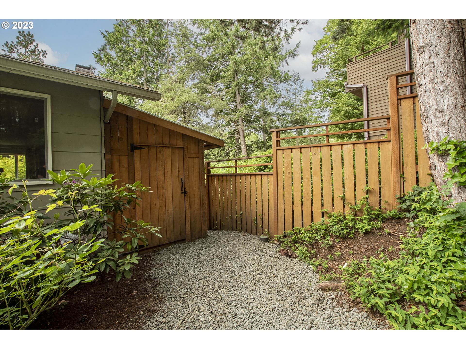 197 Brae Burn Drive Eugene, OR 97405 - Photo 41 of 42 a view of backyard with potted plants and wooden fence
