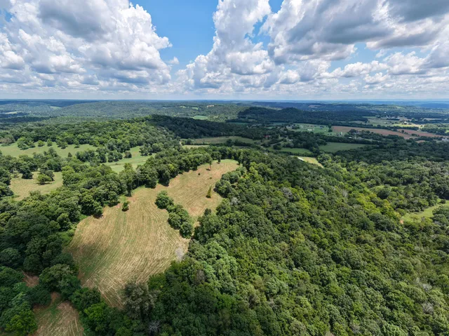 a bed room with a bed and a chair