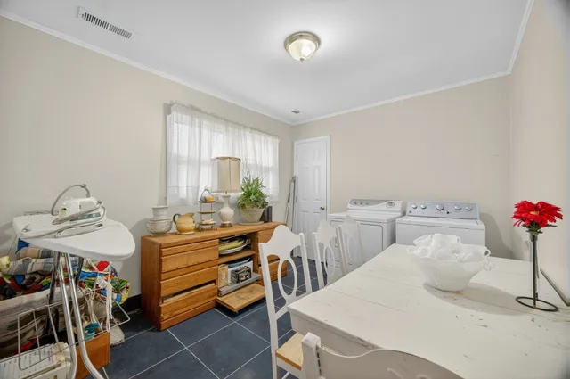 a kitchen with stainless steel appliances granite countertop a stove microwave and cabinets