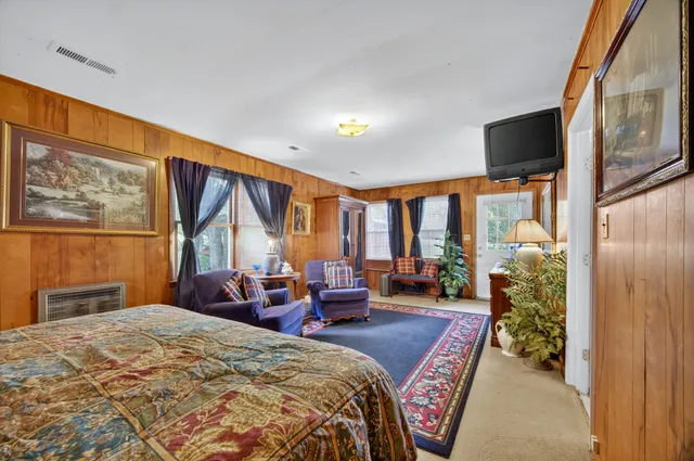 a front view of house with yard outdoor seating and barbeque oven