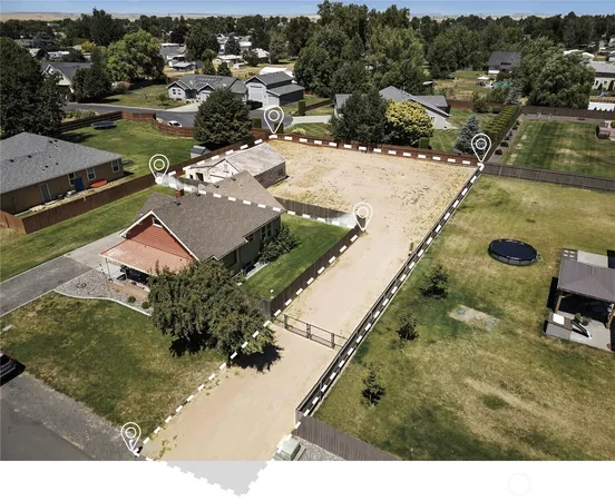 aerial view of a house with yard