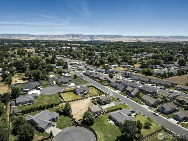 an aerial view of residential houses with outdoor space