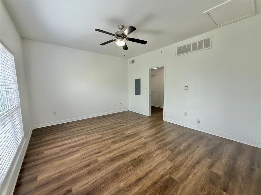 6740 Windhaven Parkway, Unit 5907 The Colony, TX 75056 - Photo 13 of 20 wooden floor in an empty room