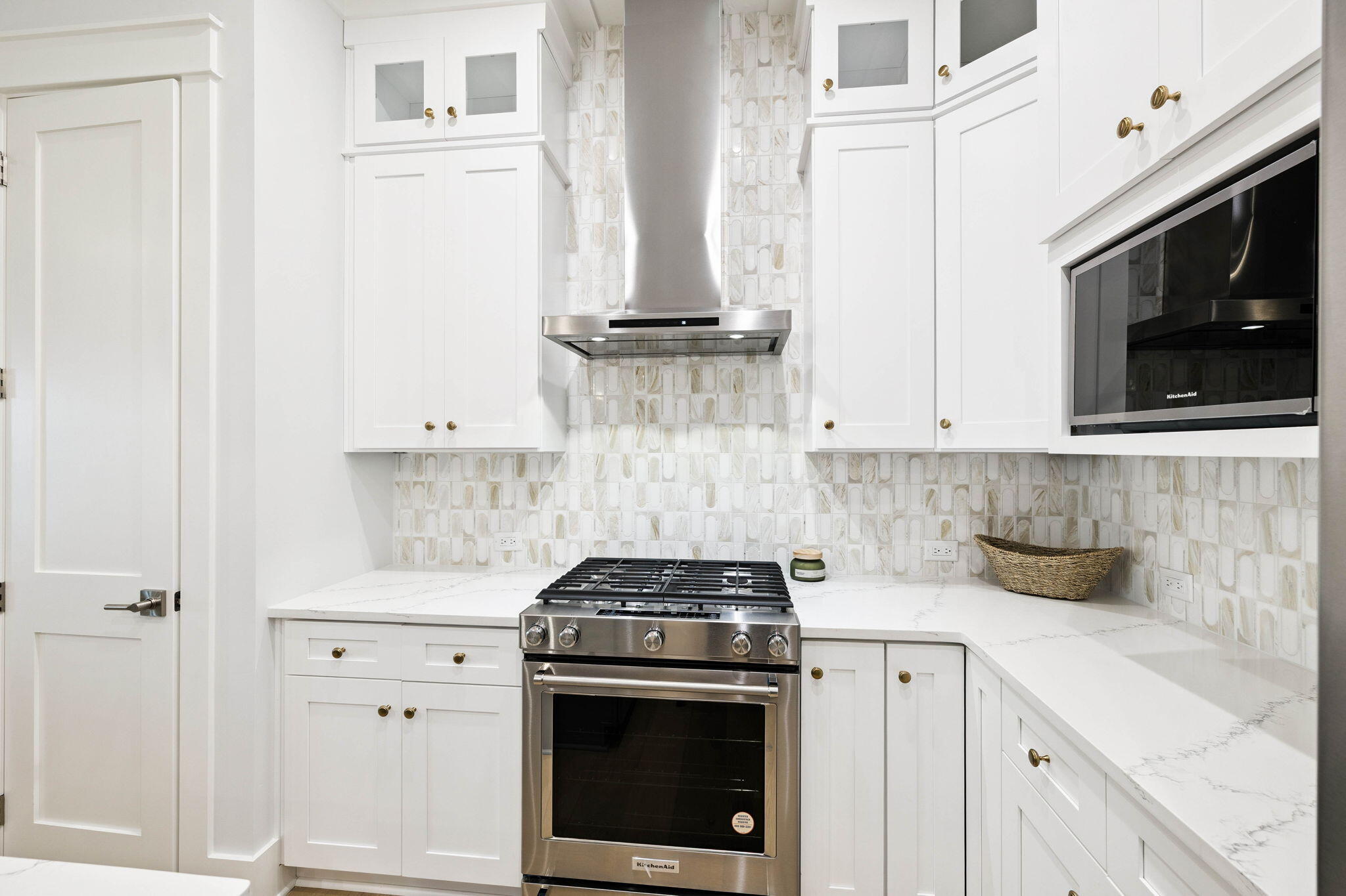 45 Grove Townhomes Place, Unit 104 Santa Rosa Beach, FL 32459 - Photo 13 of 36 a kitchen with stainless steel appliances white cabinets and a stove top oven