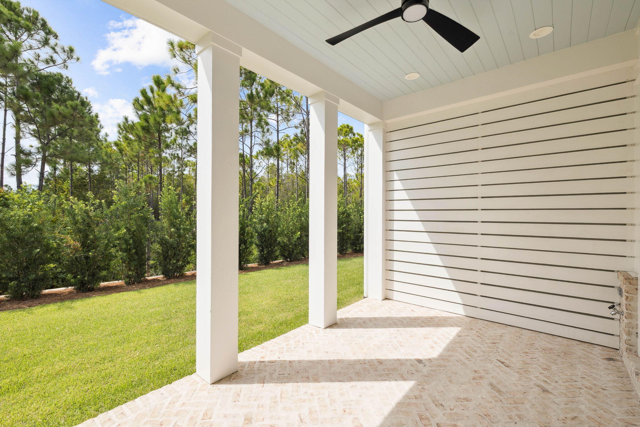 45 Grove Townhomes Place, Unit 104 Santa Rosa Beach, FL 32459 - Photo 21 of 36 a view of a porch with a garden