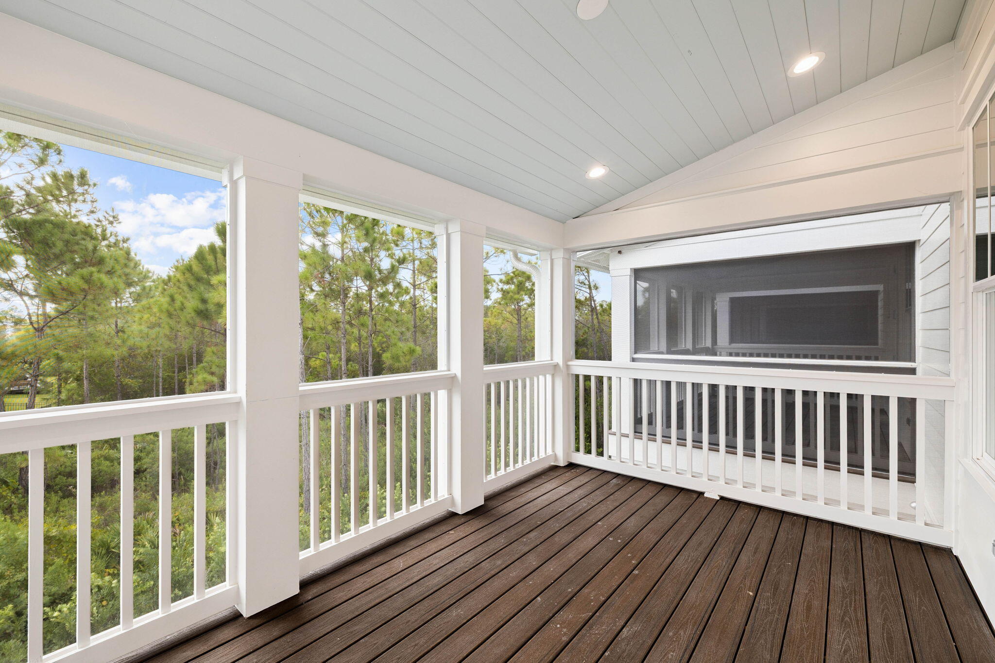 45 Grove Townhomes Place, Unit 104 Santa Rosa Beach, FL 32459 - Photo 31 of 36 a view of wooden balcony with wooden floor