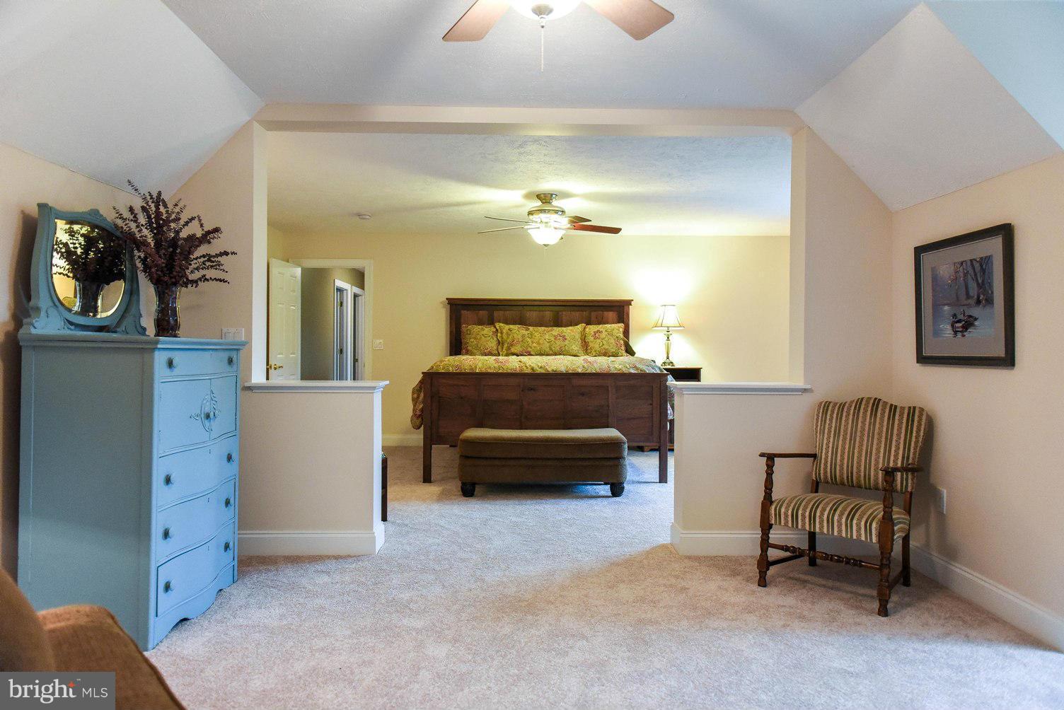 18522 Cherryfield Road Drayden, MD 20630 - Photo 13 of 30 a bedroom with furniture and a couch