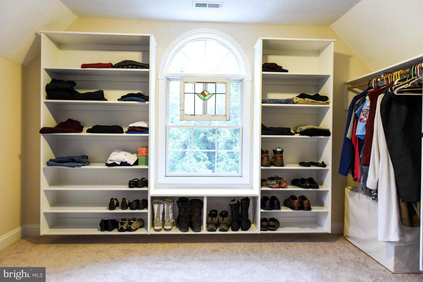 18522 Cherryfield Road Drayden, MD 20630 - Photo 14 of 30 a view of walk in closet with clothes and shoes