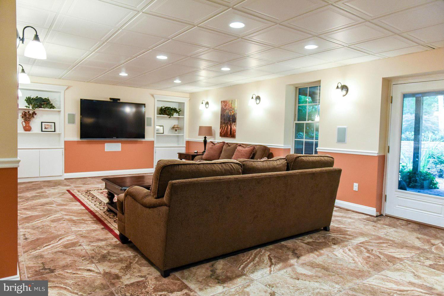 18522 Cherryfield Road Drayden, MD 20630 - Photo 19 of 30 a living room with furniture and a flat screen tv