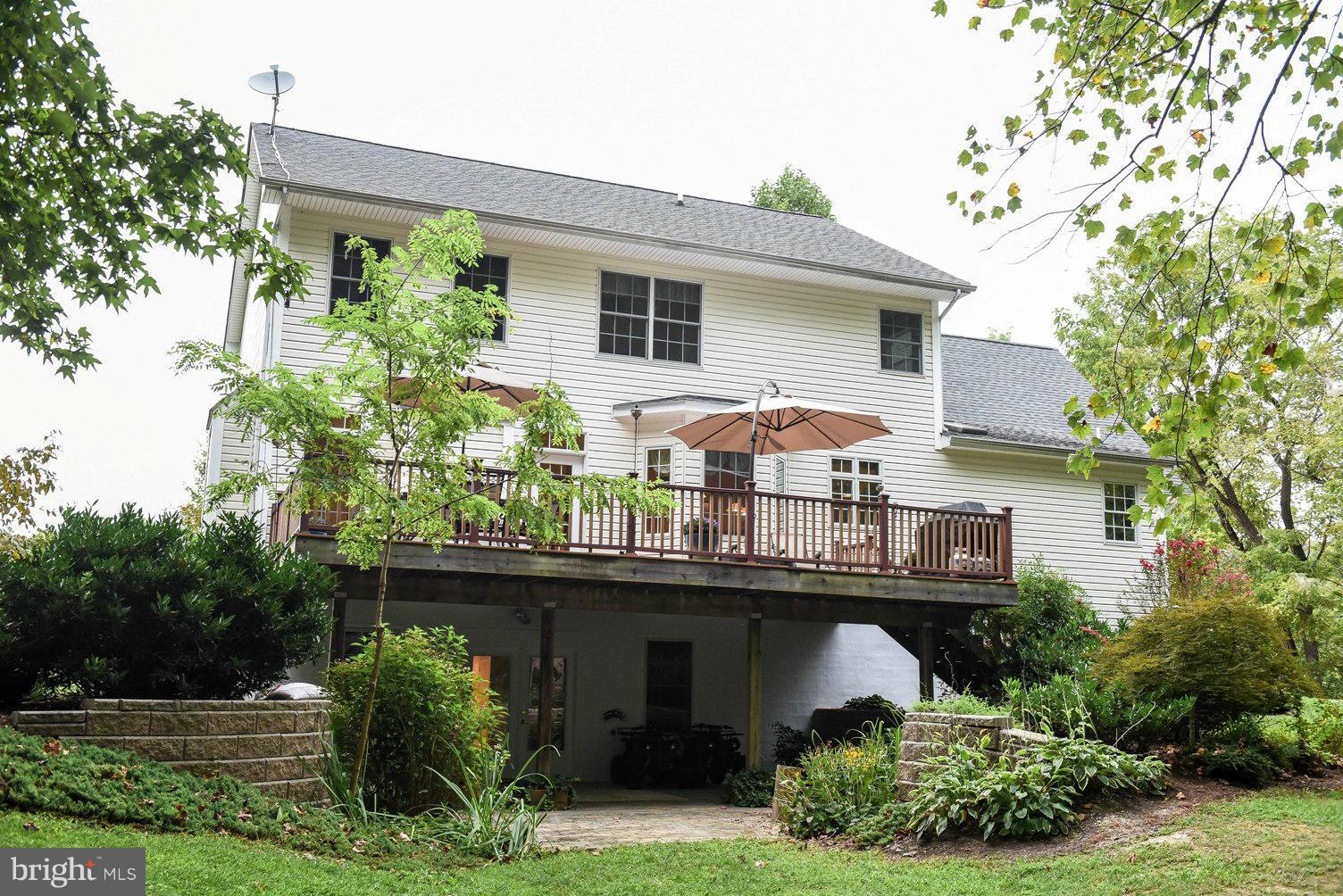 18522 Cherryfield Road Drayden, MD 20630 - Photo 24 of 30 front view of a house with potted plants