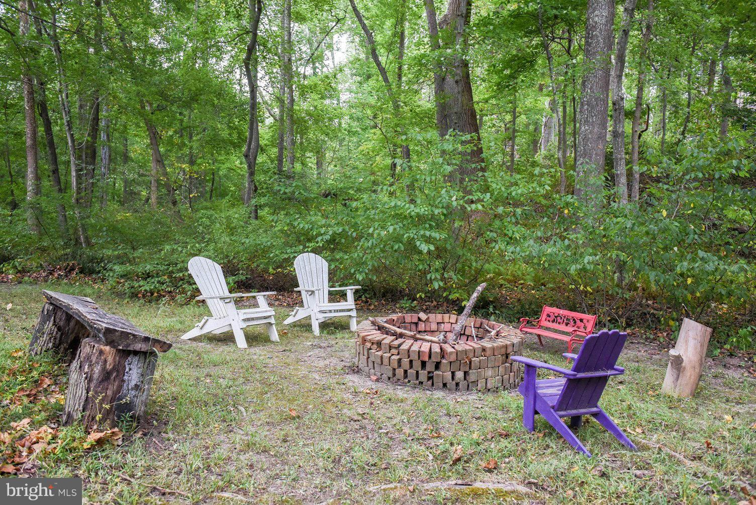 18522 Cherryfield Road Drayden, MD 20630 - Photo 25 of 30 a view of a chairs in a backyard