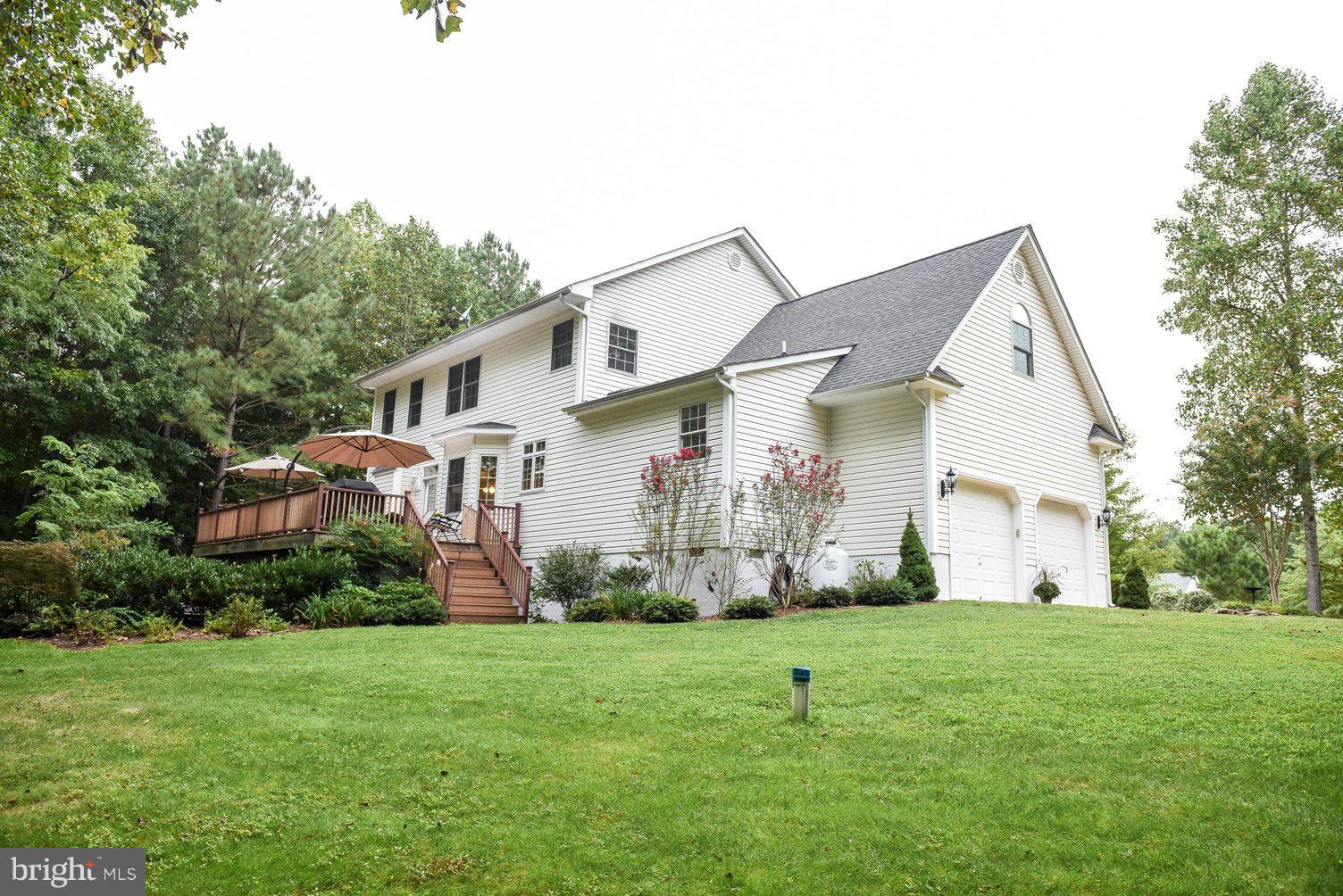 18522 Cherryfield Road Drayden, MD 20630 - Photo 26 of 30 a front view of house with yard and green space