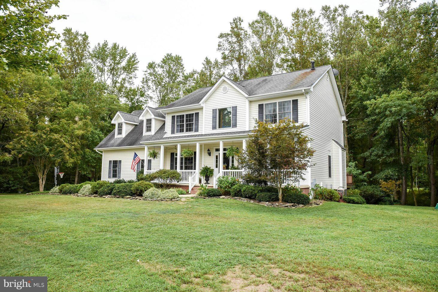 18522 Cherryfield Road Drayden, MD 20630 - Photo 27 of 30 a front view of house with yard and green space