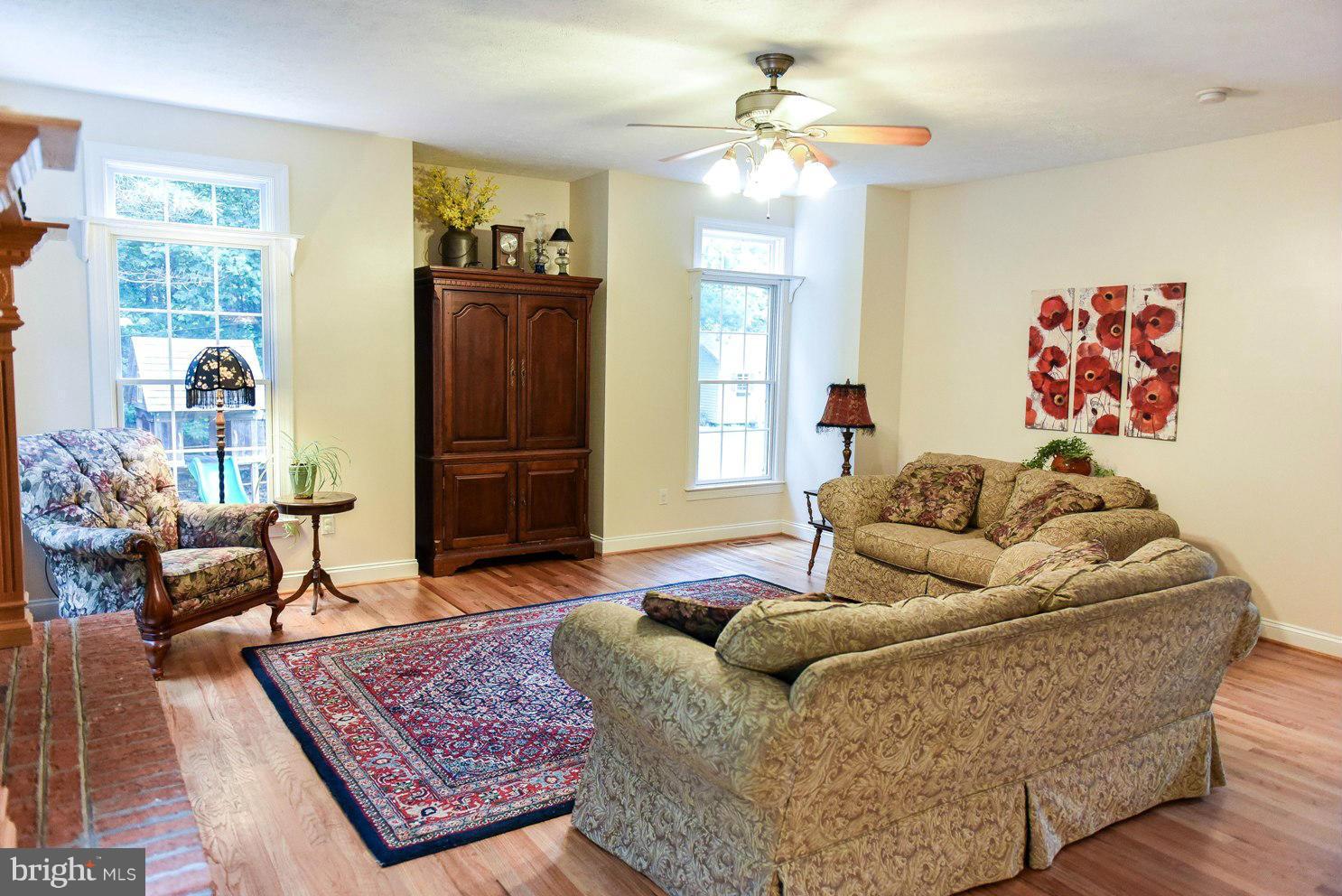 18522 Cherryfield Road Drayden, MD 20630 - Photo 9 of 30 a living room with furniture and wooden floor
