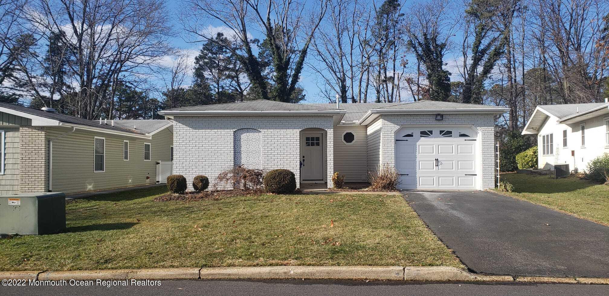 67 Markham Road Brick, NJ 08724 - Photo 1 of 16 a front view of a house with garden