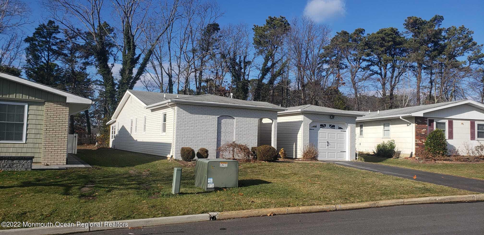67 Markham Road Brick, NJ 08724 - Photo 3 of 16 a front view of a house with garden