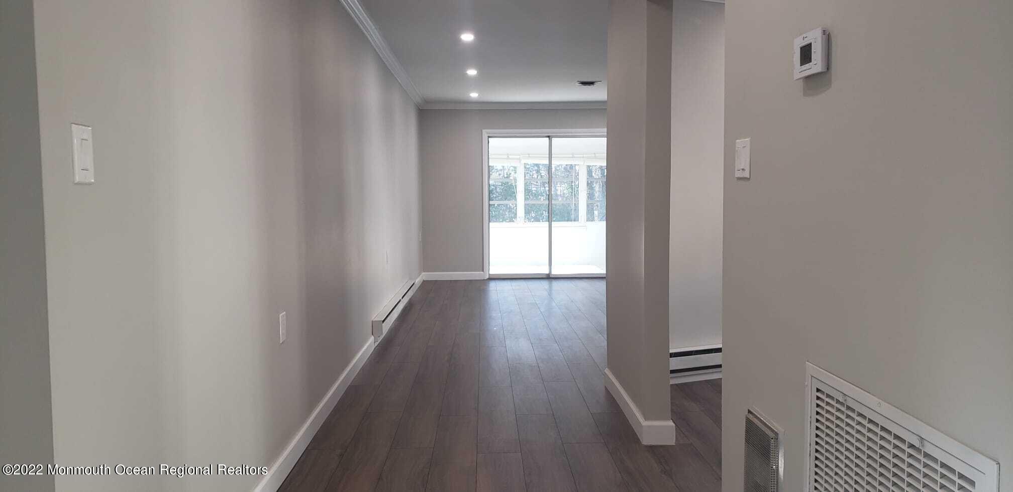 67 Markham Road Brick, NJ 08724 - Photo 10 of 16 a view of hallway with wooden floor