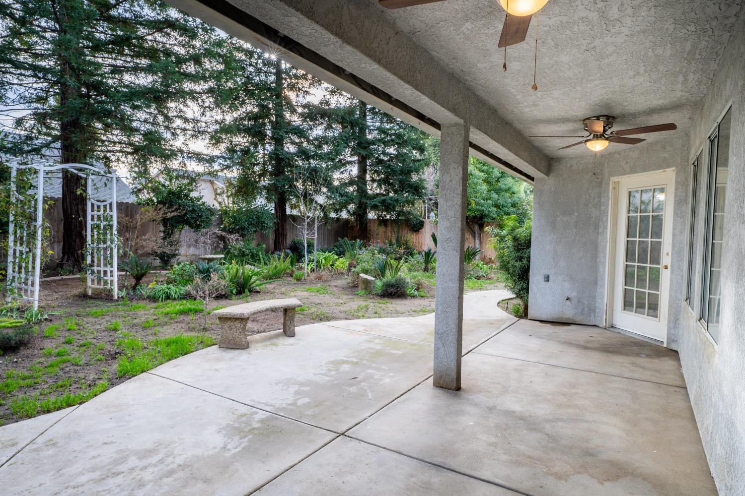 118 Oak Avenue Clovis, CA 93611 - Photo 19 of 22 a view of a porch with chairs and backyard