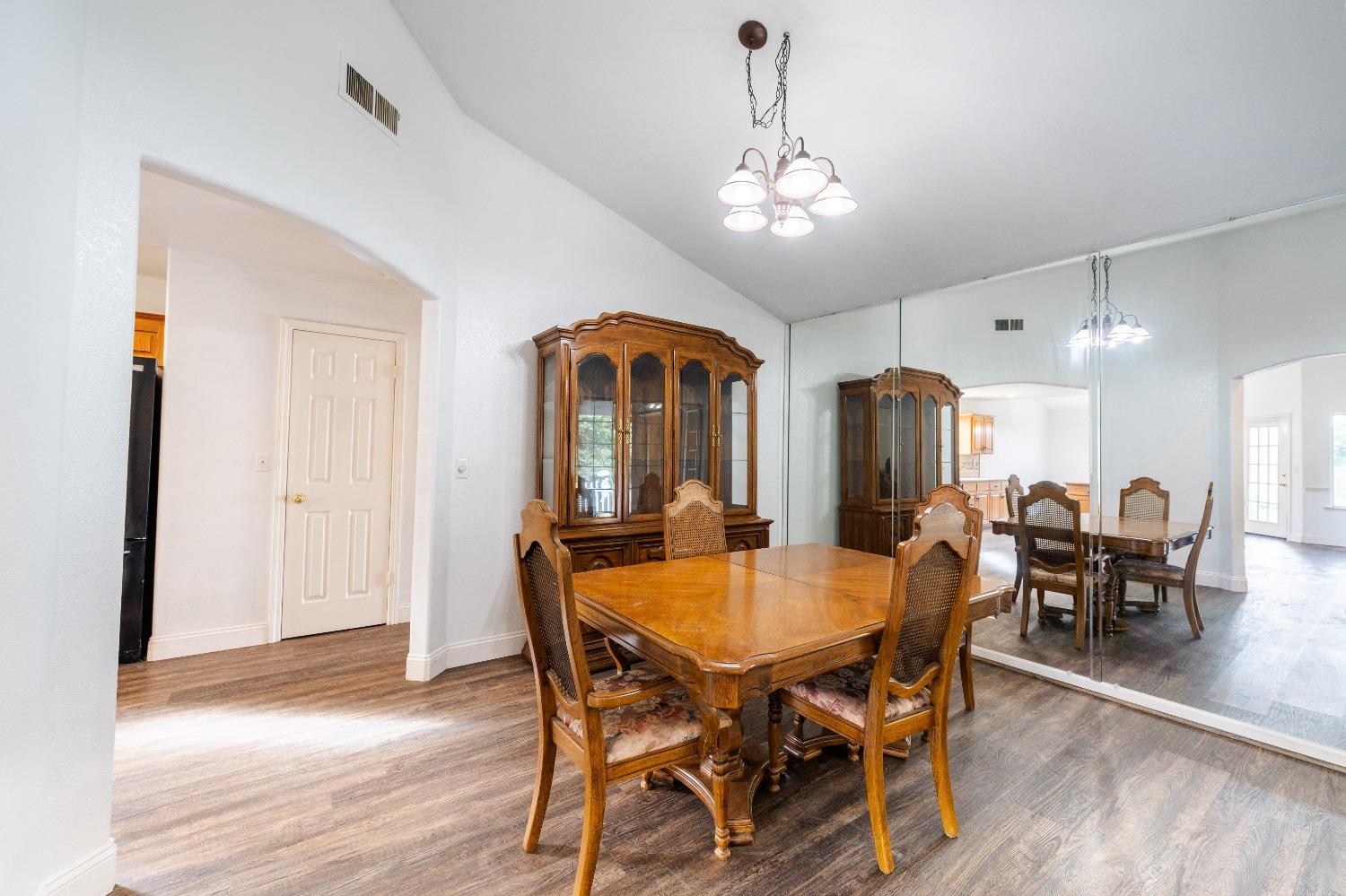 118 Oak Avenue Clovis, CA 93611 - Photo 9 of 22 a view of a dining room with furniture and wooden floor