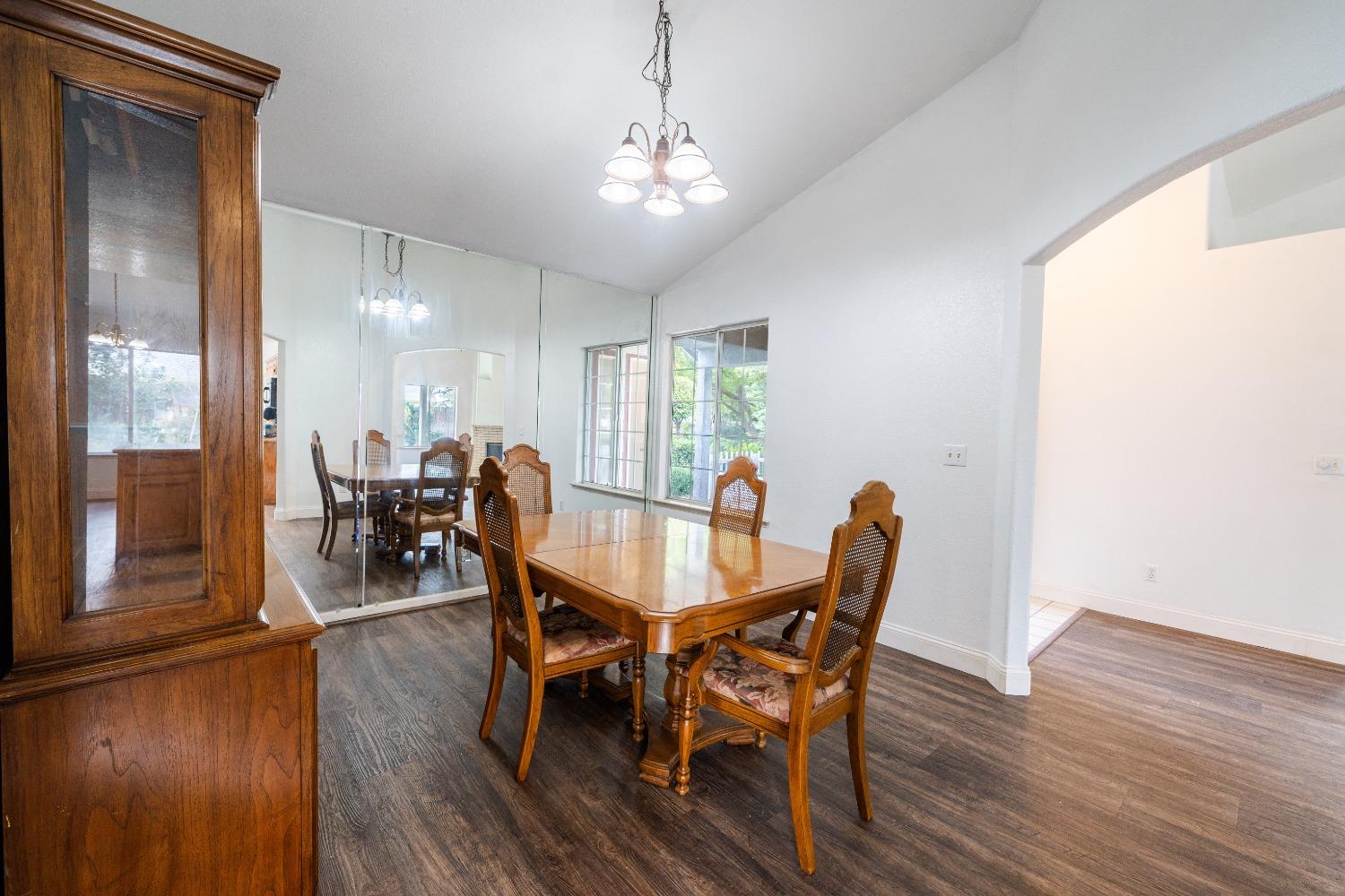 118 Oak Avenue Clovis, CA 93611 - Photo 10 of 22 a view of a dining room with furniture and wooden floor