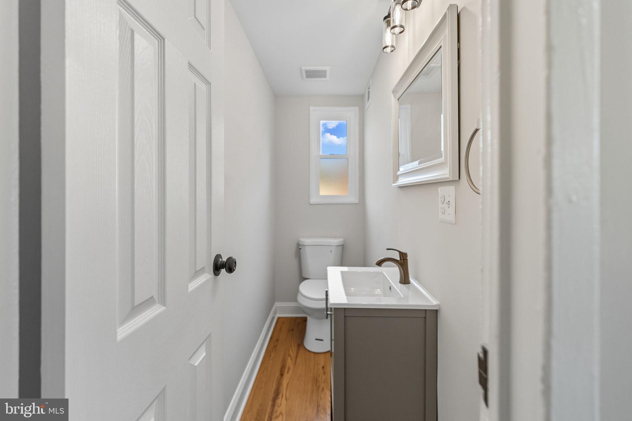 5916 8th Street Northeast Washington, DC 20011 - Photo 13 of 27 a bathroom with a sink and mirror with shower