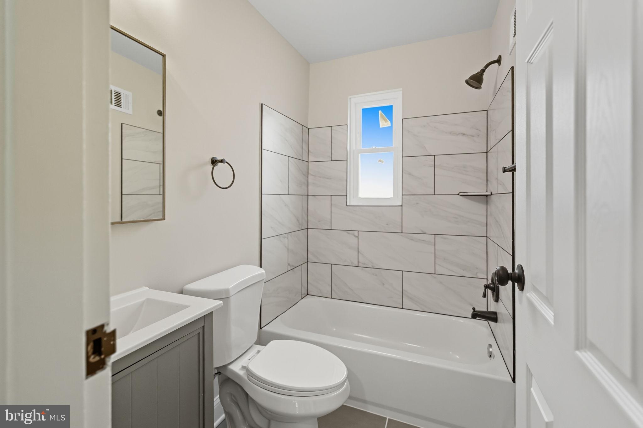 5916 8th Street Northeast Washington, DC 20011 - Photo 14 of 29 a bathroom with a toilet and shower