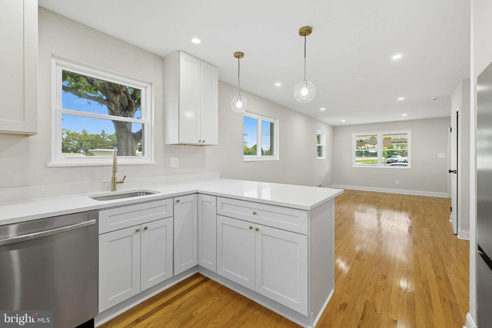 5916 8th Street Northeast Washington, DC 20011 - Photo 2 of 29 a kitchen with a sink window and cabinets