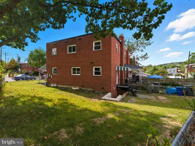 a view of a backyard with swimming pool
