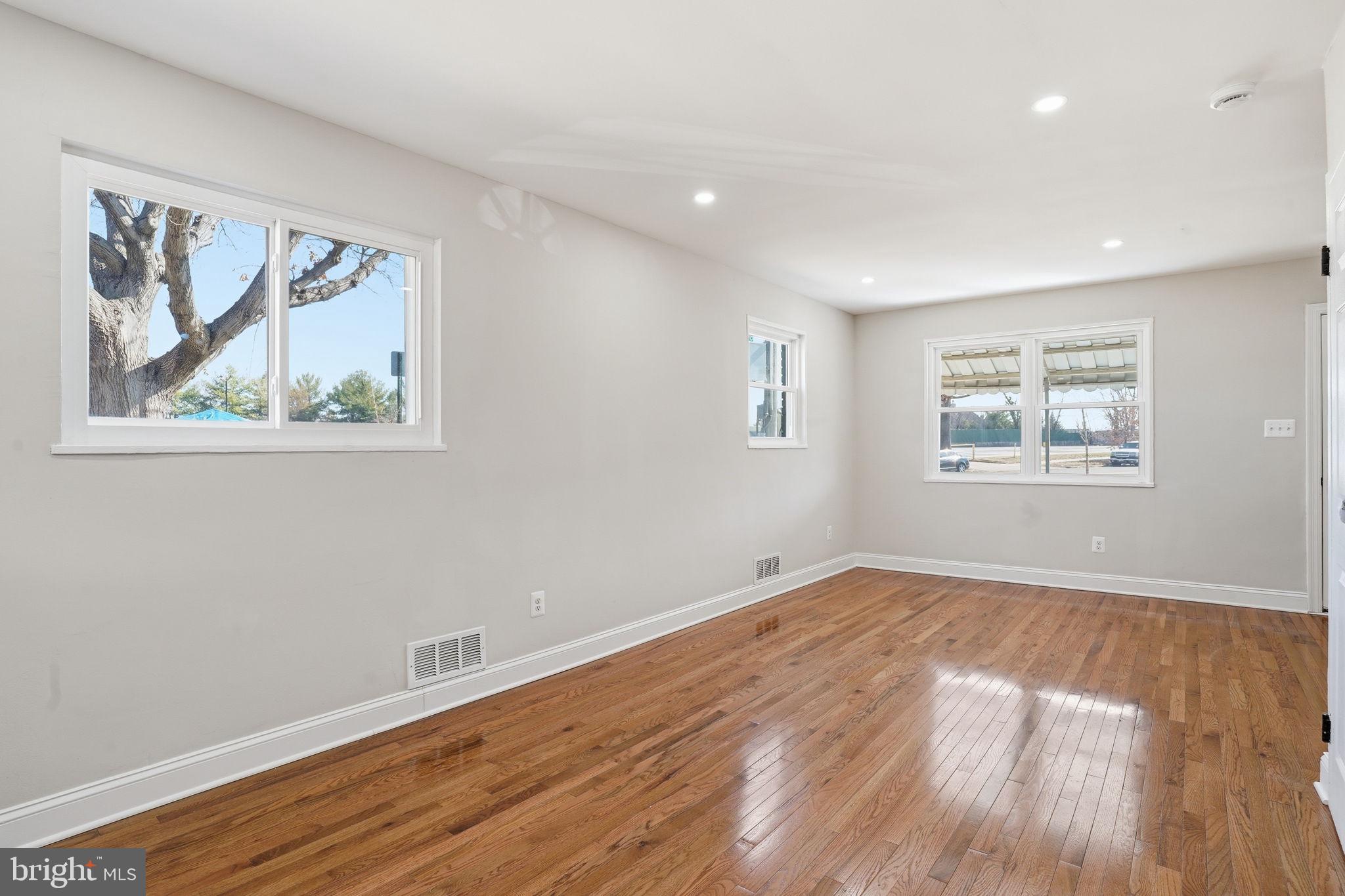 5916 8th Street Northeast Washington, DC 20011 - Photo 5 of 27 a view of empty room with wooden floor and fan