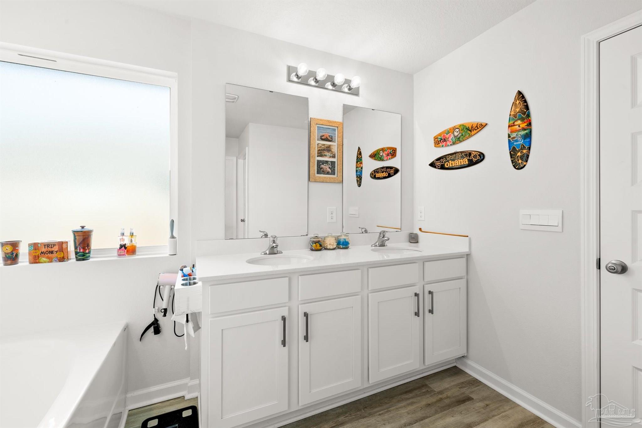 4774 Carl Booker Road Milton, FL 32583 - Photo 14 of 35 a bathroom with a sink and a mirror