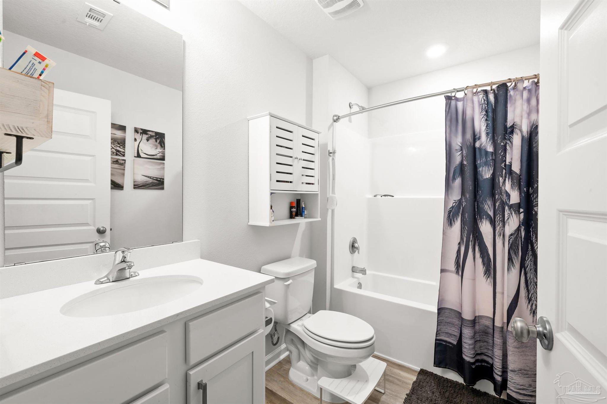 4774 Carl Booker Road Milton, FL 32583 - Photo 22 of 35 a bathroom with a sink toilet and shower