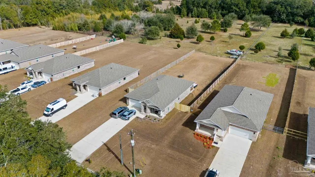 an aerial view of residential house with parking space