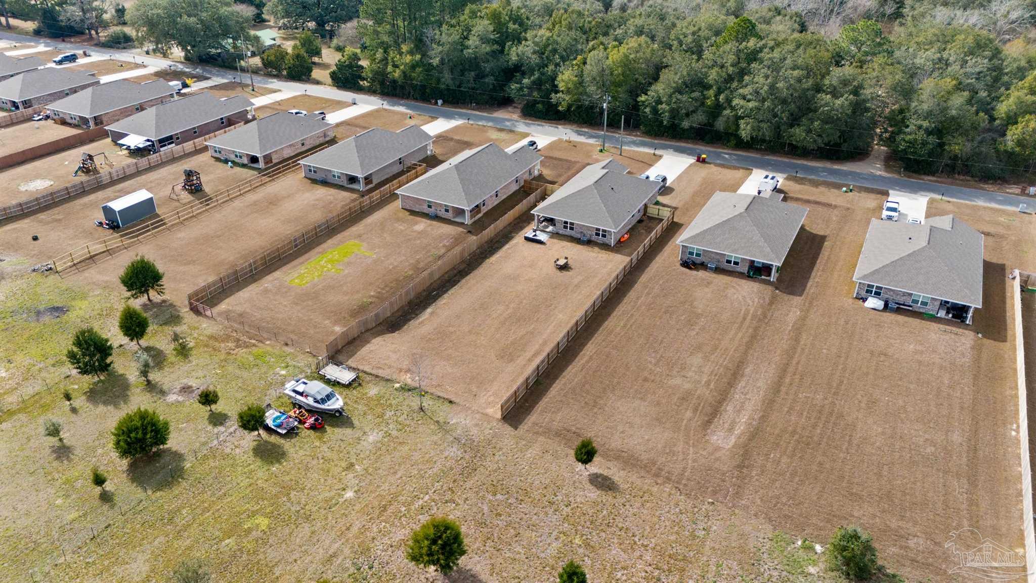 4774 Carl Booker Road Milton, FL 32583 - Photo 35 of 35 an aerial view of residential house with parking space