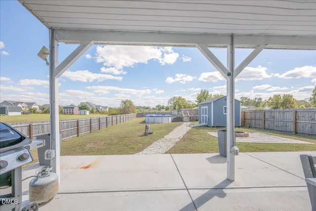 a view of house with swimming pool outdoor seating